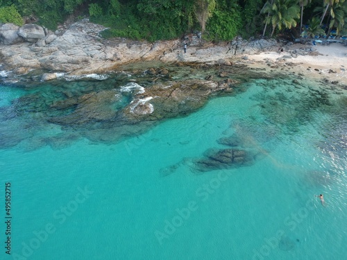 At Sea Island.Aerial view. Top view.amazing nature background.The color of the water and beautifully bright.Azure beach with rocky mountains and clear water of Thailand ocean at sunny day