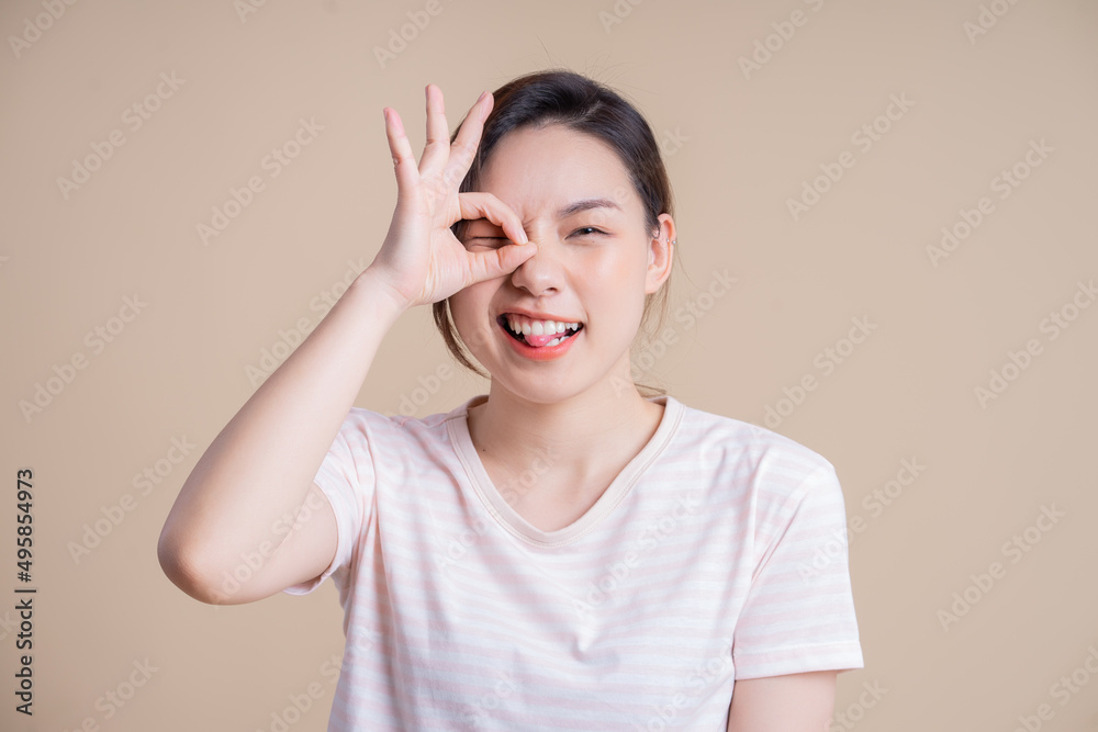 Portrait of young Asian girl posing on background Portrait of young Asian girl posing on background