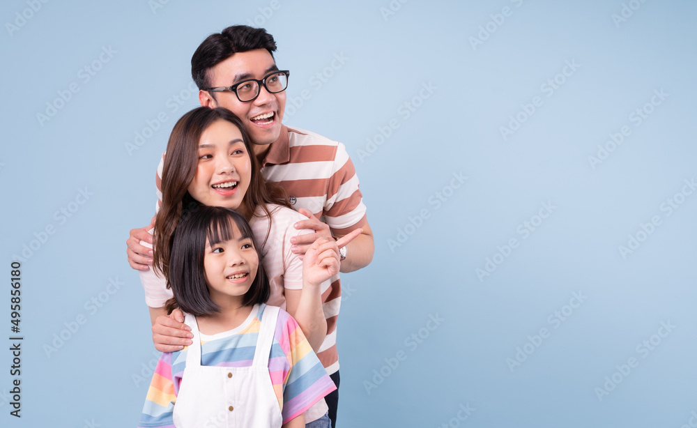 Portrait of young Asian family on background Portrait of young Asian family on background