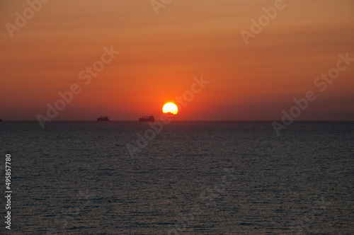 sunset sky and sea with ship on horizon  maldives