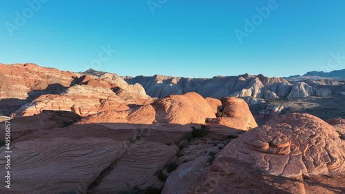 Snow Canyon State Park in southern Utah. Aerial 4k drone footage flying low over red rock to reveal the beautiful arid landscape. photo