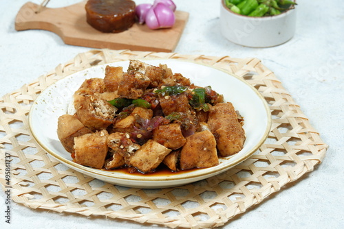 tahu gejrot , is a typical food from Cirebon, Indonesia.Traditional street food dish of fried bean curd with crushed shallot and green chili in sweet soy sauce