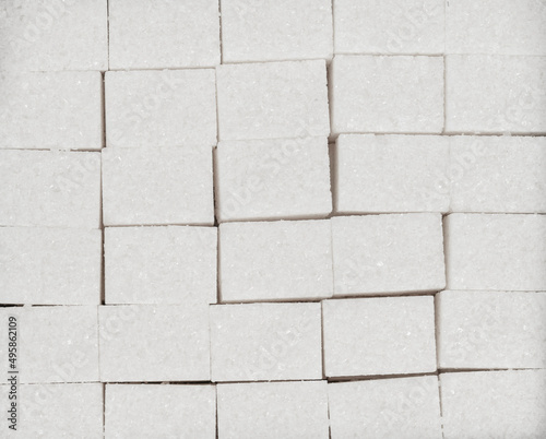 Natural white sugar cubes texture background