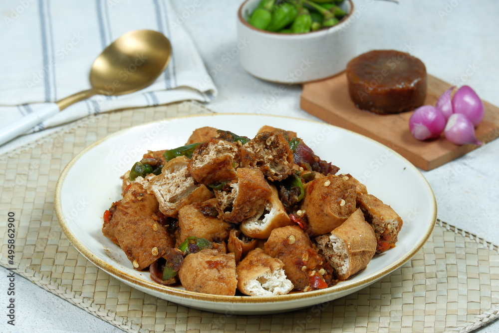 tahu gejrot , is a typical food from Cirebon, Indonesia.Traditional street food dish of fried bean curd with crushed shallot and green chili in sweet soy sauce