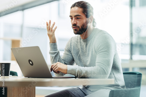 Fotografie Businessman speaking during an online meeting