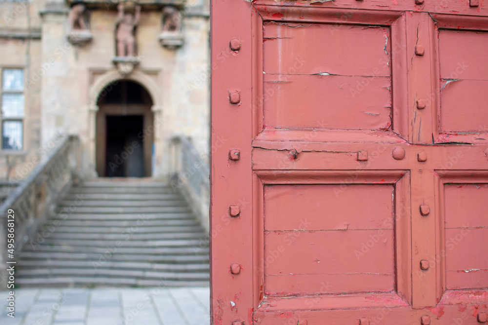 Focus on red gate at Bolslover Castle in Derbyshire, UK Focus on red gate at Bolslover Castle in Derbyshire, UK