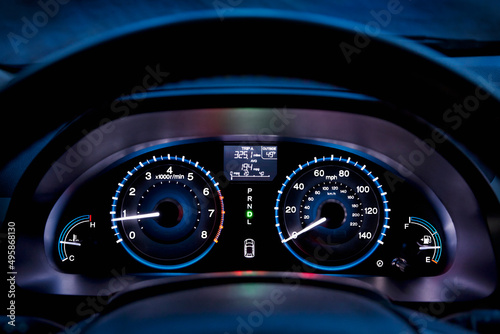 Tachometer, car dashboard,instrument panel,and fuel gauge. A speedometer