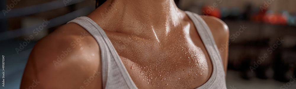 Close up of shoulders and neck fit female with sweat on skin after workout - obrazy, fototapety, plakaty 