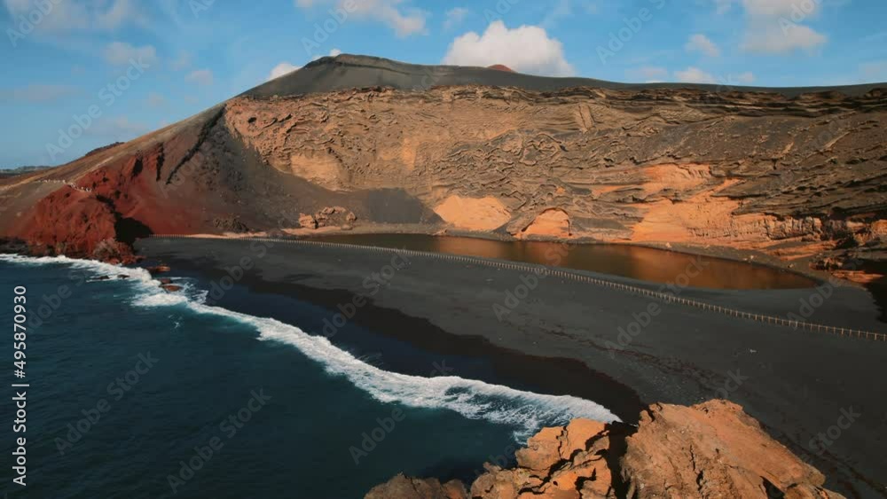 Beautiful drone point of view volcanic green lake or El Lago Verde, Charco de los Clicos viewpoint in El Golfo. Lanzarote. Canary Islands. Spain. Famous places and landmark, travel destination concept