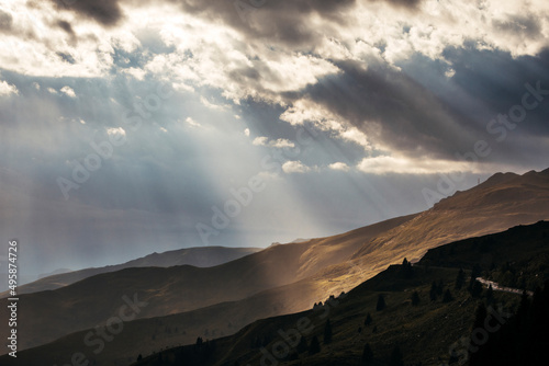 sunset over the mountains with sunrays