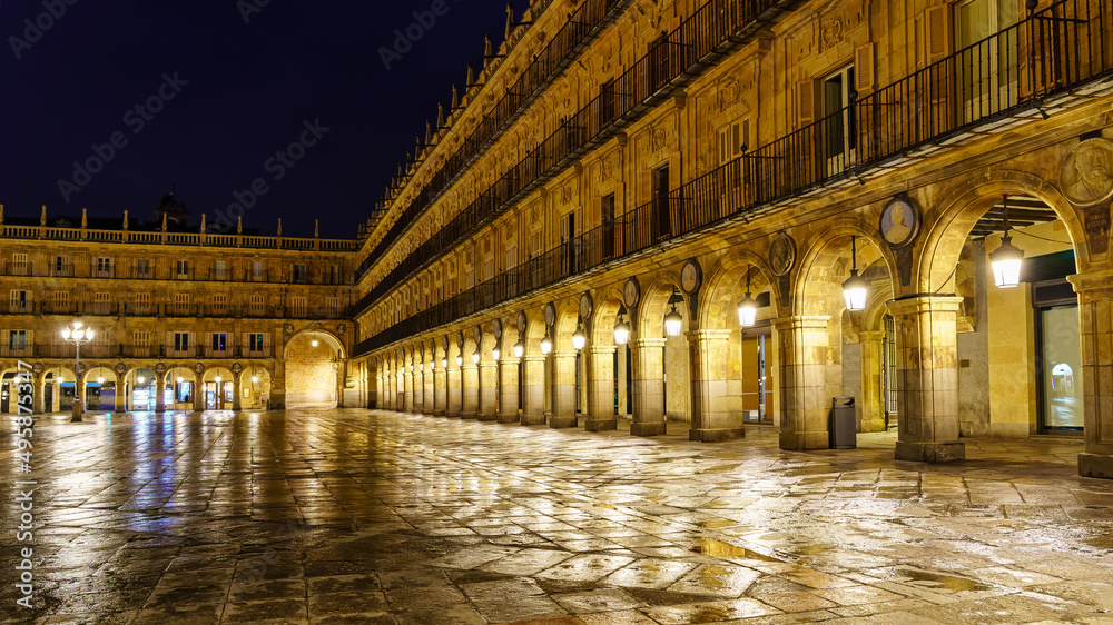 Plaza Mayor of Salamanca at night, on a rainy day.