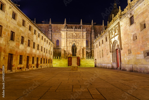 Night view of the square of medieval buildings of the University of Salamanca.