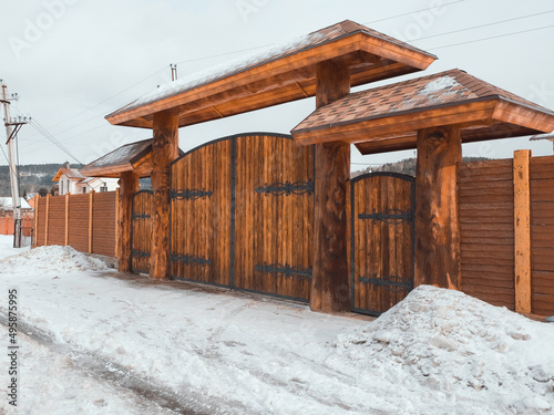 March in the village of Mansky, the snow began to melt, wooden cottages