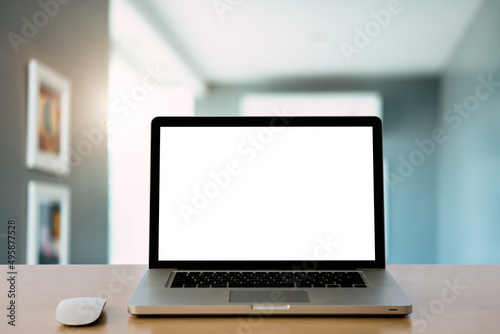 Laptop or notebook with blank screen on service counter in blurry background with parcel delivery office express © Khun Mix