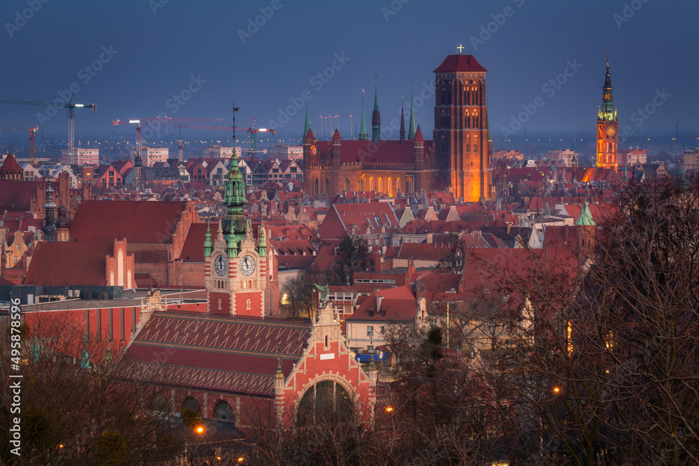 Fototapeta premium Cityscape of Gdansk with St. Mary Basilica, City Hall and the Railway Station building, Poland.