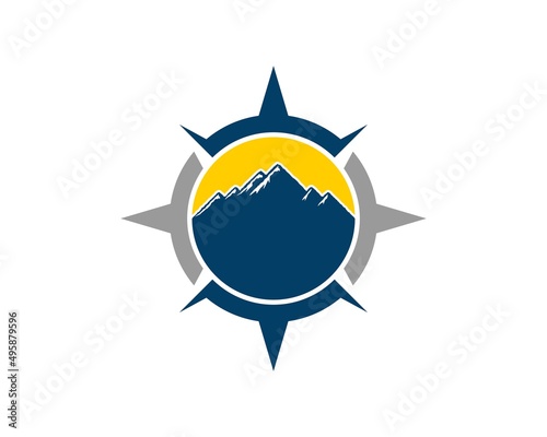 Modern compass with mountain and sunset inside