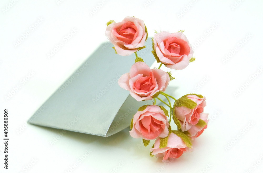 Minimal birthday or wedding mock-up scene, artificial flower with empty card on white background