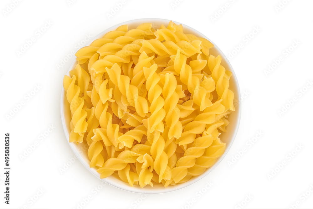 raw Fusilli pasta in ceramic bowl isolated on white background with clipping path and full depth of field. Top view. Flat lay raw Fusilli pasta in ceramic bowl isolated on white background with clipping path and full depth of field. Top view. Flat lay
