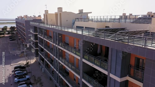 Aerial view of the urban area of portugal in the south of houses with modern infrastructure swimming pools overlooking the sea. Southern city of Portugal Olhao.