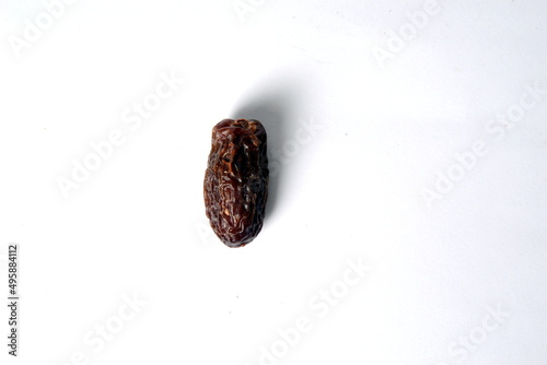 Fresh almonds in the wooden bowl, Organic almonds, almonds border white background, Almond nuts on a dark wooden background. Healthy snacks. Top view. Free space for text. photo