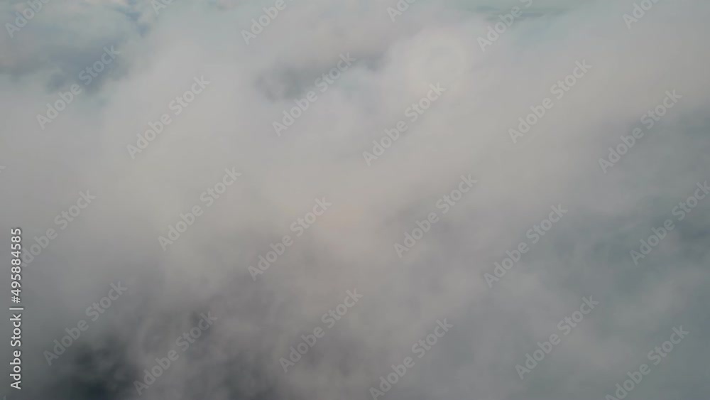 Fly through the clouds during sunrise. An epic shot of clouds in morning colors. Fly through the clouds during sunrise. An epic shot of clouds in morning colors.