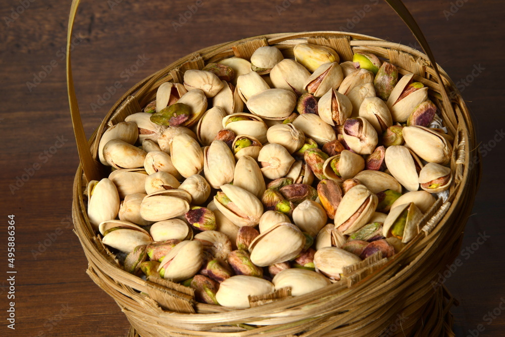 Fresh almonds in the wooden bowl, Organic almonds, almonds border white background, Almond nuts on a dark wooden background. Healthy snacks. Top view. Free space for text. Fresh almonds in the wooden bowl, Organic almonds, almonds border white background, Almond nuts on a dark wooden background. Healthy snacks. Top view. Free space for text.