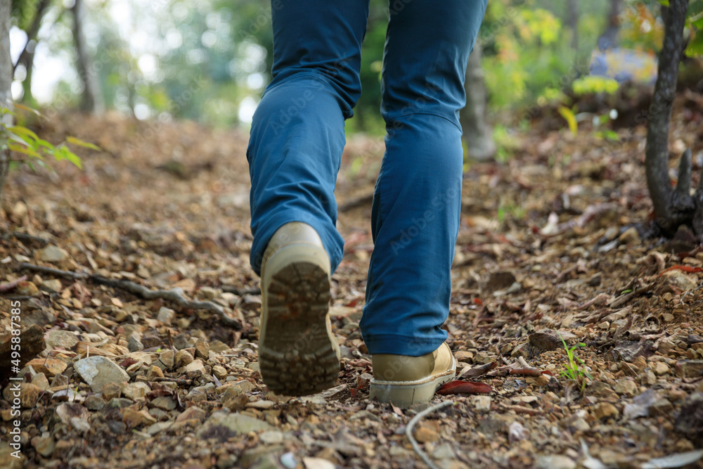 Legs hiking in spring forest mountain Legs hiking in spring forest mountain