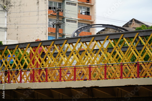 Famous Boa Vista Bridge over the Capibaribe River in the historic city of Recife, the capital of the Brazilian state of Pernambuco. The railings were constructed from old English railroad tracks. #495887703