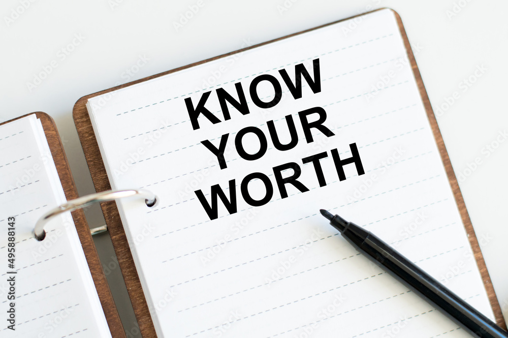 Know Your Worth inscription on a notebook on a desk, a business concept Know Your Worth inscription on a notebook on a desk, a business concept