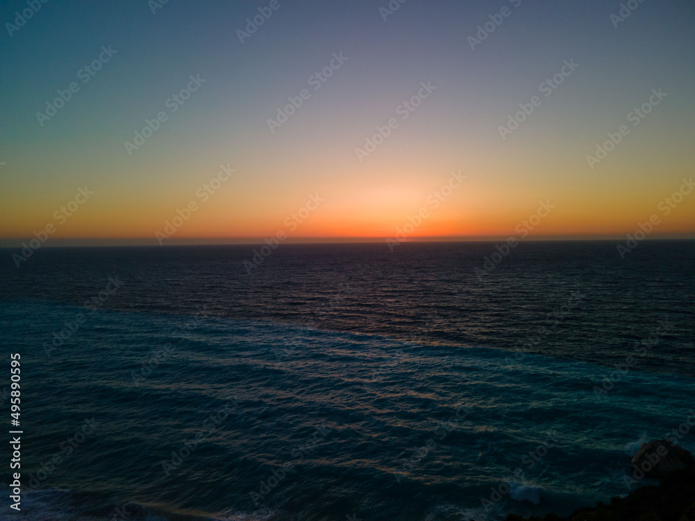 sun disk at sea horizon colorful sunset