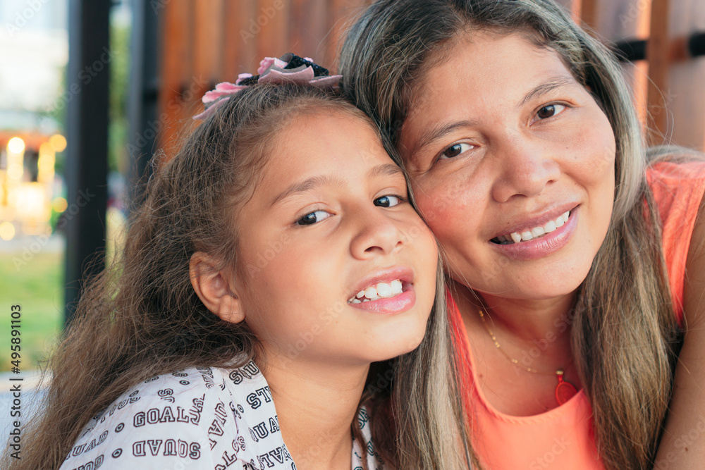 Portrait of a woman and a young daughter