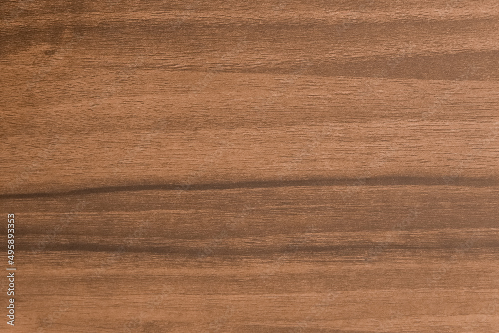 Brown wooden texture in chestnut color, table board or walnut floor with natural abstract plank pattern background Brown wooden texture in chestnut color, table board or walnut floor with natural abstract plank pattern background