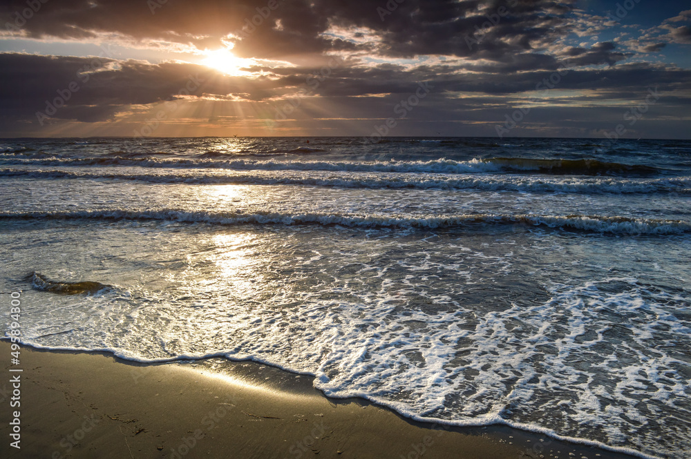 Surreal sunset with stormy clouds  at Baltic Sea, Miedzyzdroje, Poland