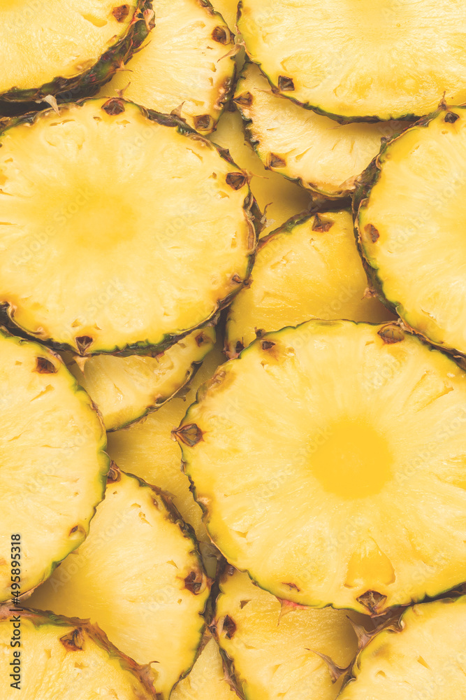 Pineapple juicy yellow slices background. Top view. Pineapple juicy yellow slices background. Top view.