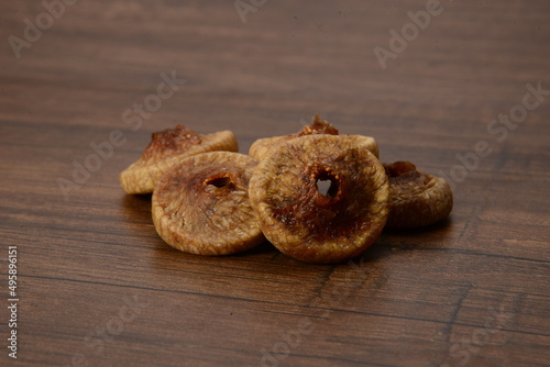 Fresh almonds in the wooden bowl, Organic almonds, almonds border white background, Almond nuts on a dark wooden background. Healthy snacks. Top view. Free space for text. photo