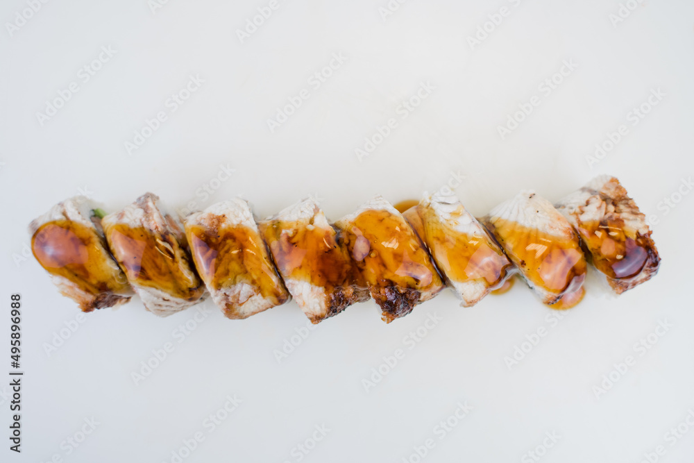 sushi roll with eel and unagi sauce on a plate japanese cuisine sushi roll with eel and unagi sauce on a plate japanese cuisine