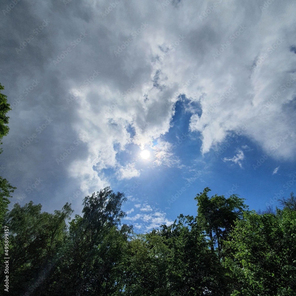 overtaking clouds in the summer sky overtaking clouds in the summer sky