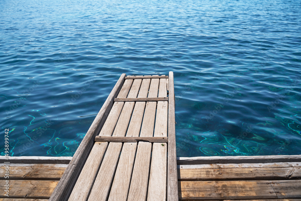 Empty wooden deck with the sea in the background. Empty wooden deck with the sea in the background.