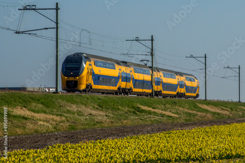 Amsterdam, Netherlands, march 2022. Dutch train in the landscape and in the central station