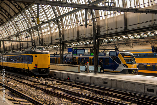 Amsterdam, Netherlands, march 2022. Dutch train in the landscape and in the central station