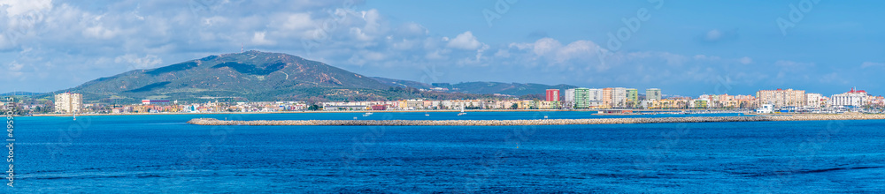 A panorama view towards the runway and Spain from Gibraltar Bay on a spring day