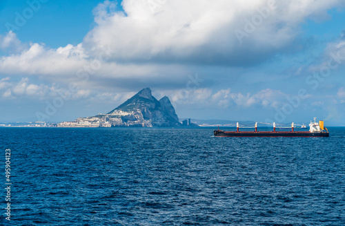 A view of a bulk carrier vessel sailing through the Straits of Gibraltar on a spring day photo