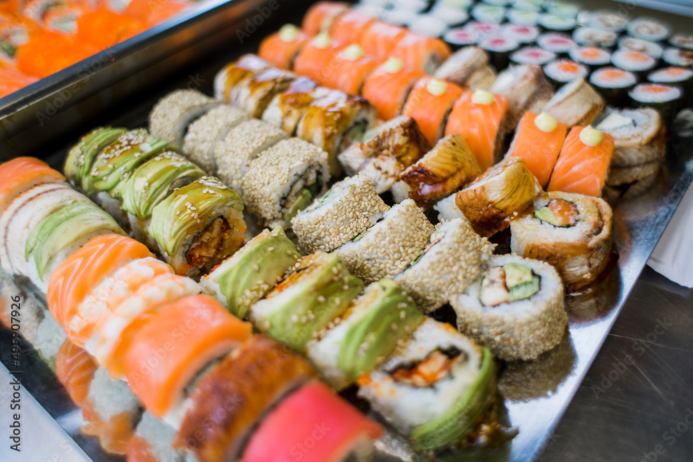 set of rolls set sushi with avocado shrimp salmon and eel