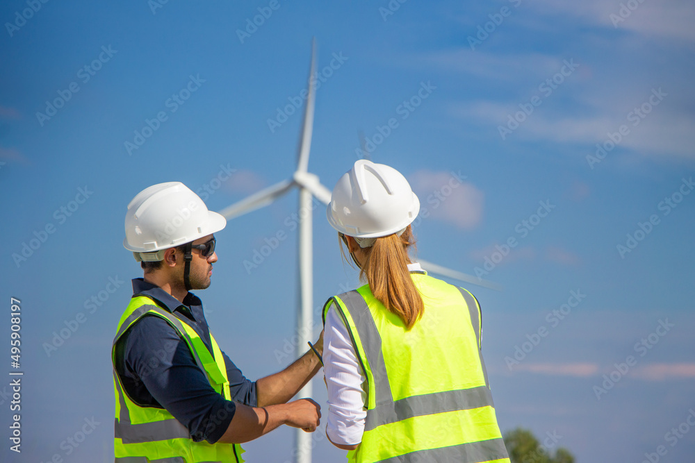 engineer team working in wind turbine farm. Renewable energy with wind generator by alternative energy concept. engineer team working in wind turbine farm. Renewable energy with wind generator by alternative energy concept.