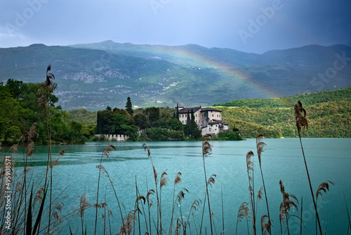 Rainbow over the Toblino lake and its castle. Madruzzo, Trento province, Trentino Alto-Adige, Italy, Europe. photo