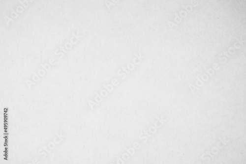 White recycled craft paper texture as background. Grey paper texture, Old vintage page or grunge cardboard with copy space for text.