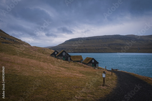 Picturesque view of tradicional faroese grass-covered houses in the village Bour during autumn. Vagar island, Faroe Islands, Denmark. November 2021 photo