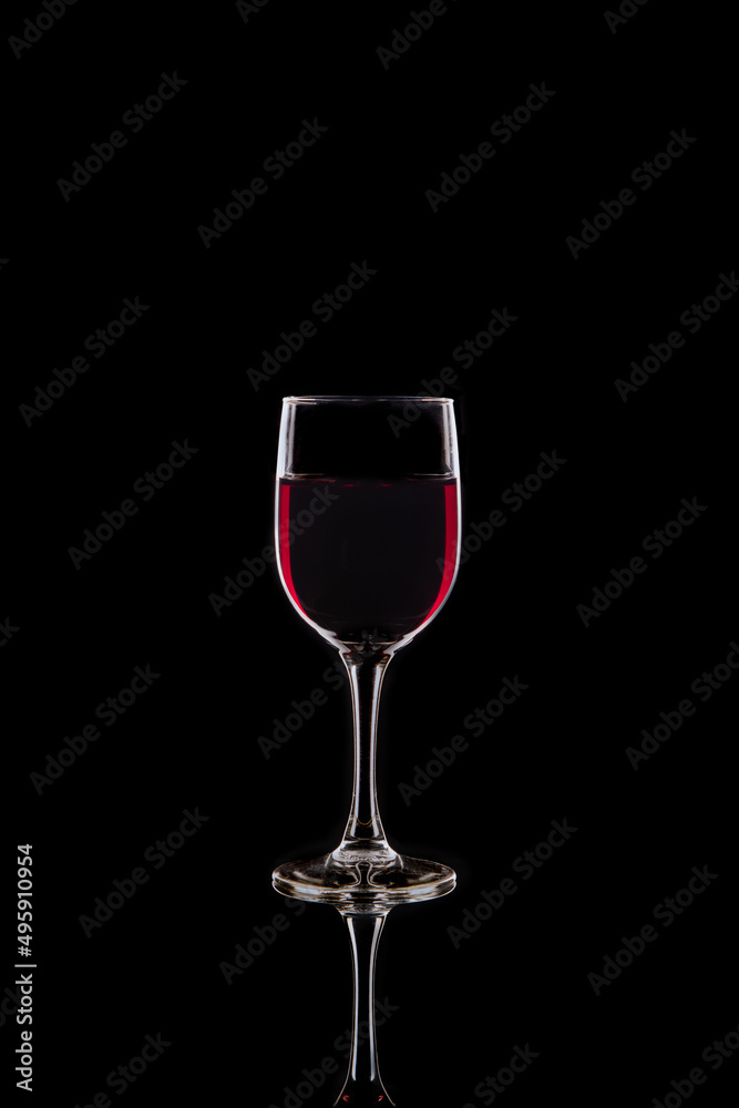 Glass of Red wine in silhouette Glass of Red wine in silhouette