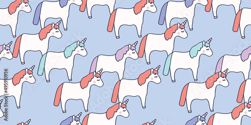 Hand drawn seamless vector pattern with cute baby unicorns on purple background. Perfect for fabric, wrapping paper or nursery decor.