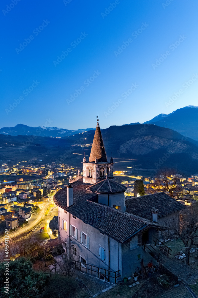 The church of Montalbano and the town of Mori. In the background the Brentonico plateau and the Mount Baldo. Vallagarina, Trento province, Trentino Alto-Adige, Italy, Europe.
